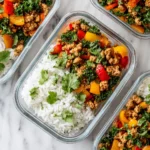 Chipotle Ground Turkey Skillet Meal Prep served hot with colorful peppers, kale, and rice in a cast-iron pan