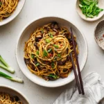 Teriyaki Stir Fry Noodles in a bowl with vegetables and glossy teriyaki sauce