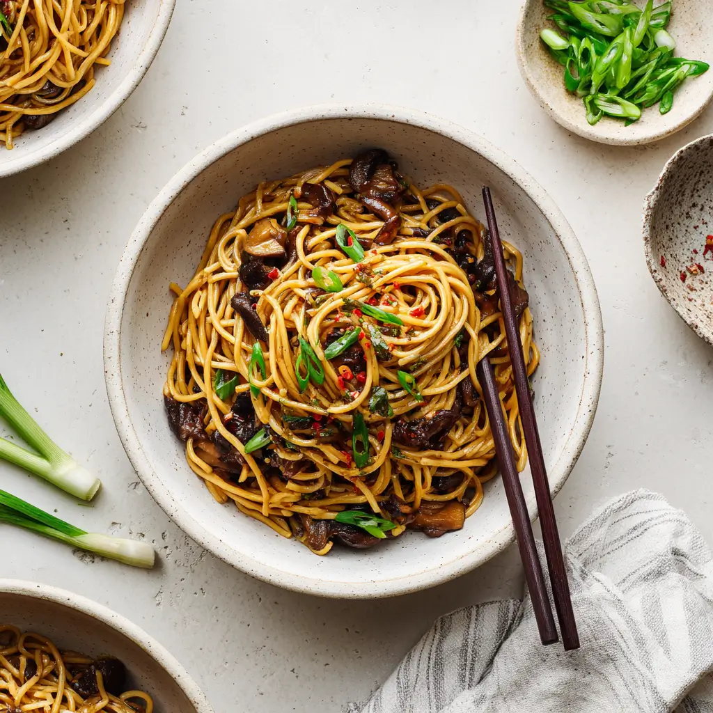 Teriyaki Stir Fry Noodles in a bowl with vegetables and glossy teriyaki sauce