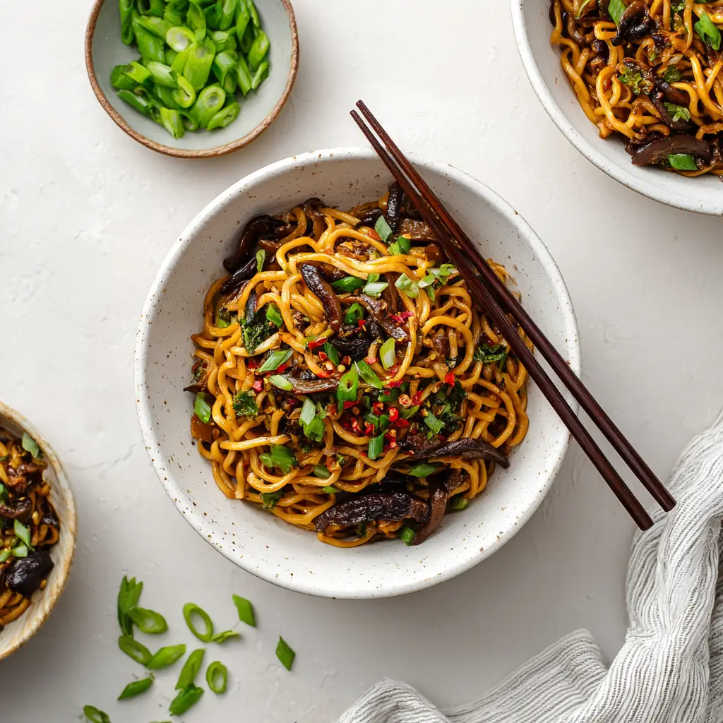 Teriyaki Stir Fry Noodles being tossed in wok with thick teriyaki sauce