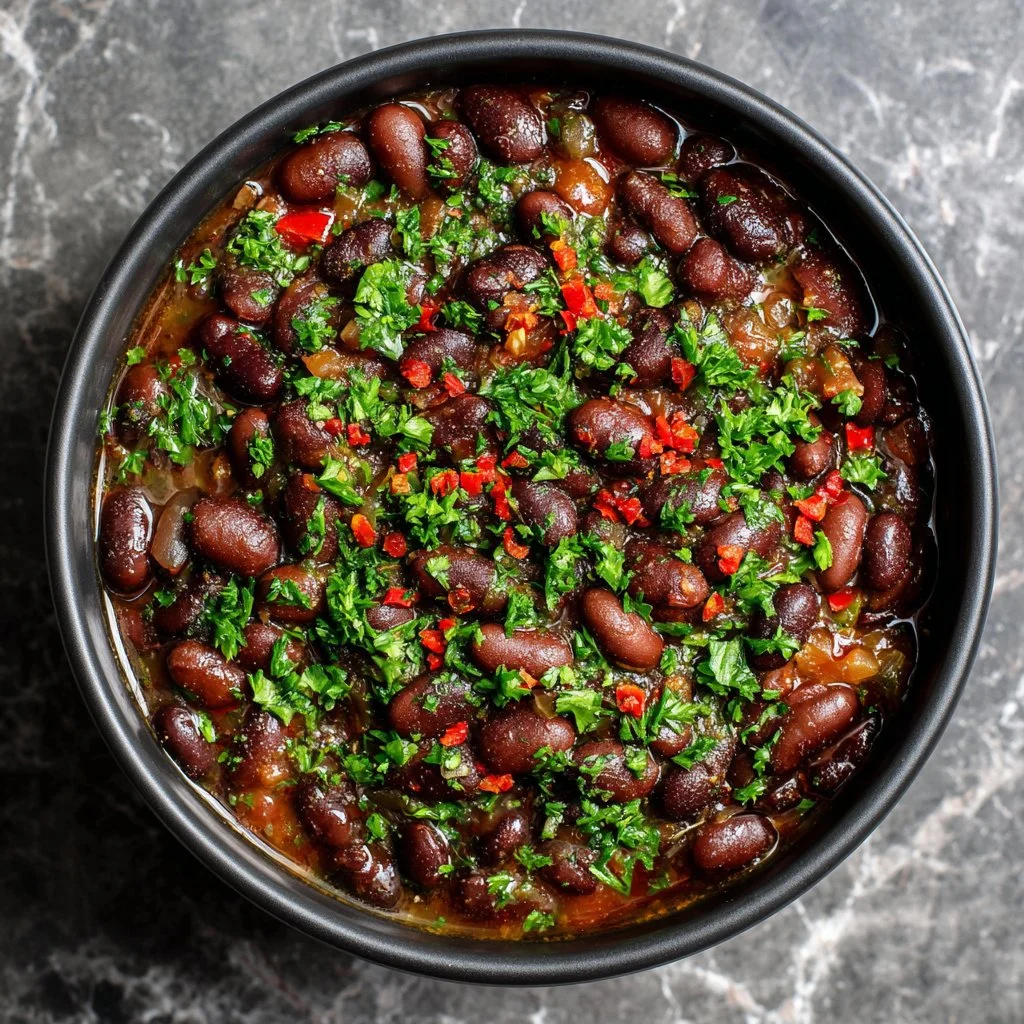 Delicious vegan black eyed peas served in a bowl garnished with herbs
