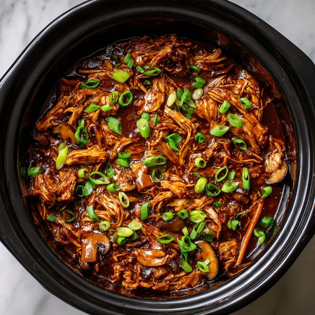 Delicious Crock Pot Bourbon Chicken served with rice and vegetables