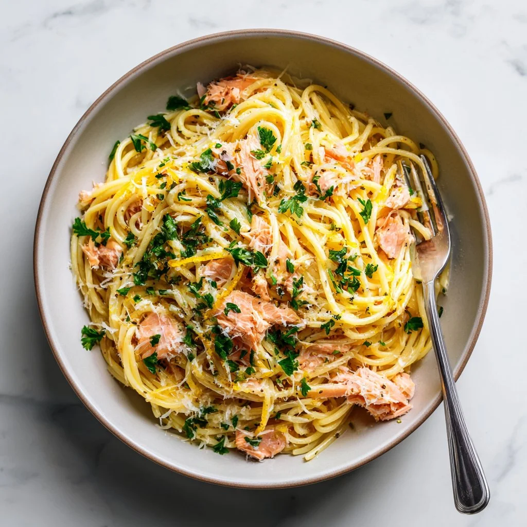 A plate of easy salmon pasta garnished with herbs, perfect for a cozy dinner.