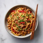 Delicious Sweet Chili Ground Chicken served on noodles